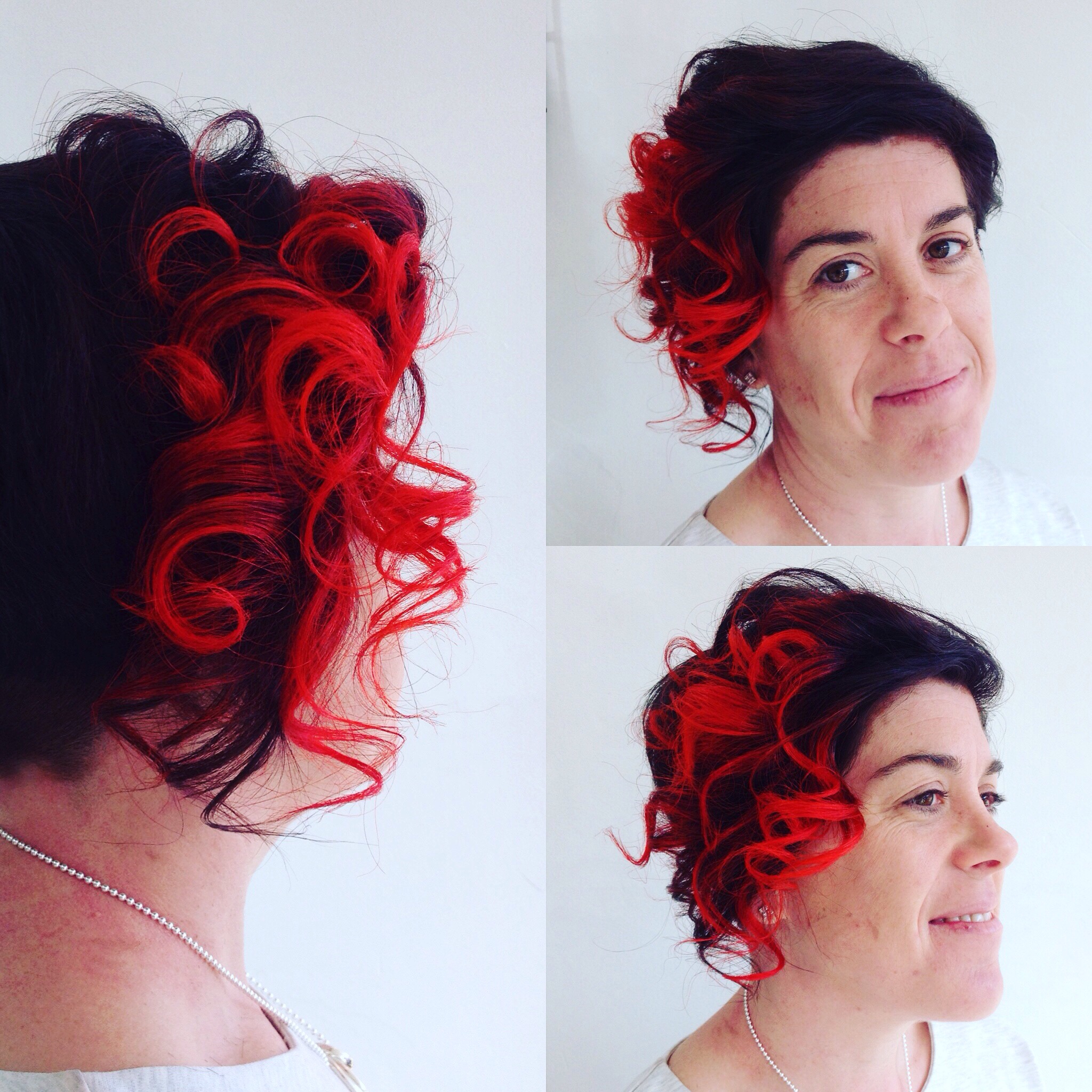 woman smiling with short hair with red colour