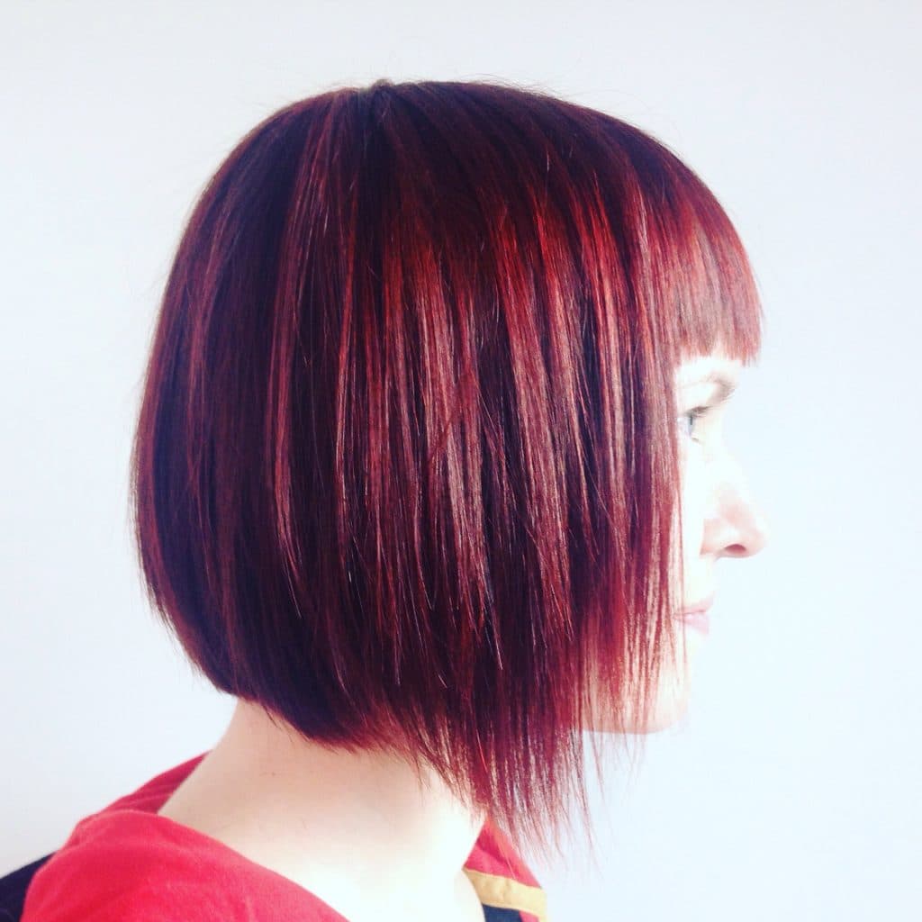 woman with short hair with red colour
