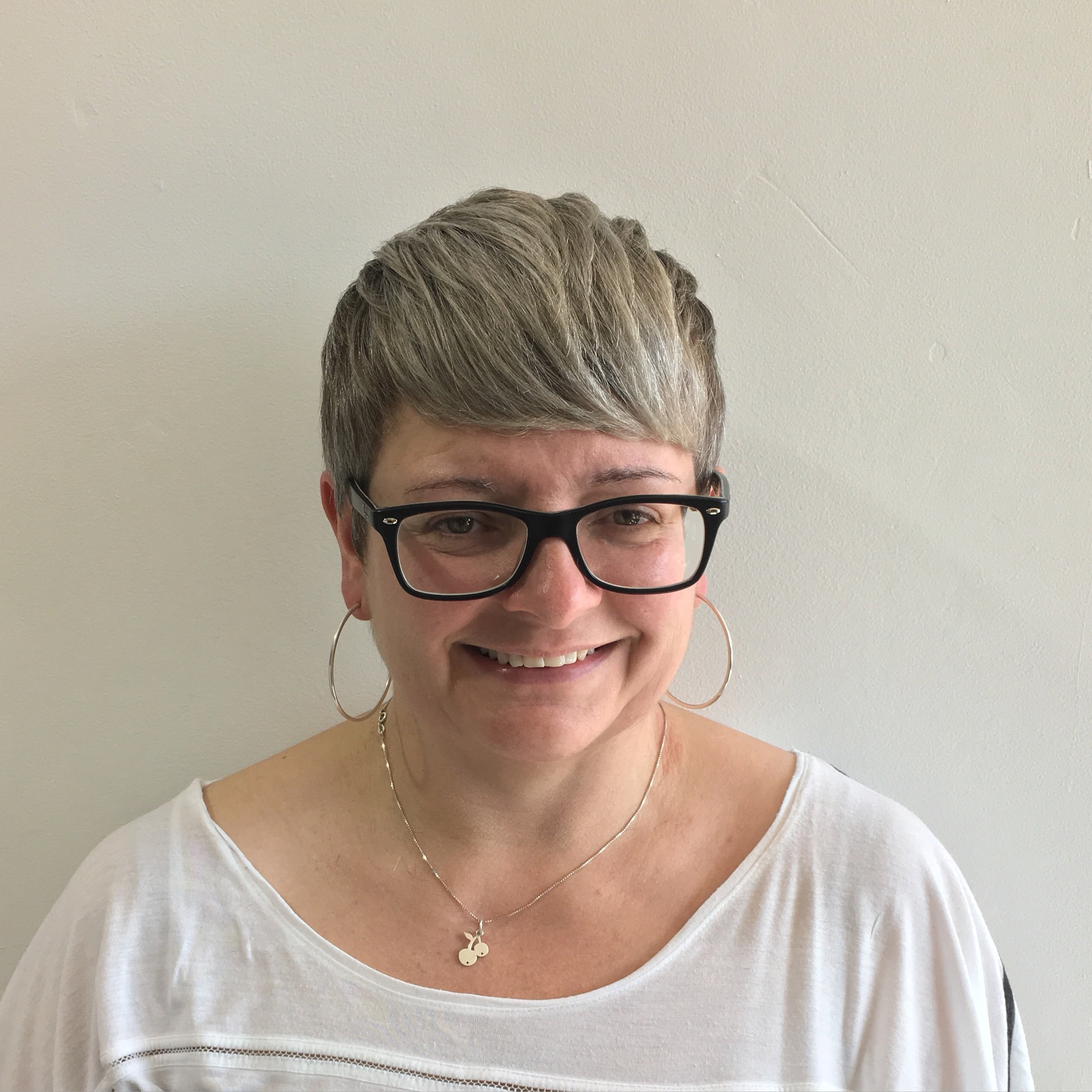 woman smiling with short hairstyle