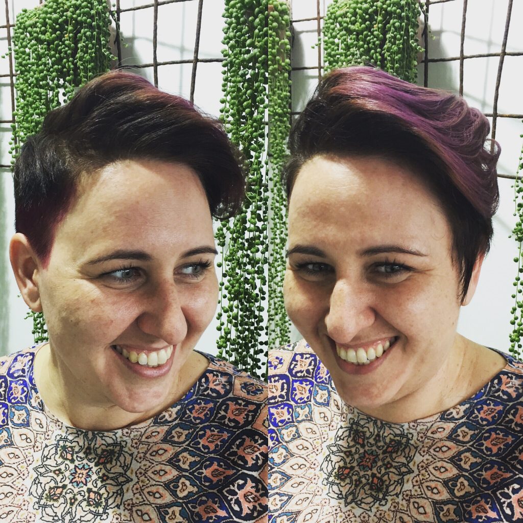 woman smiling with short hairstyle and purple colour