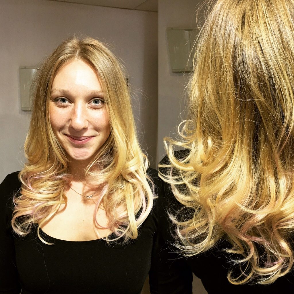 woman smiling with blonde curly hair