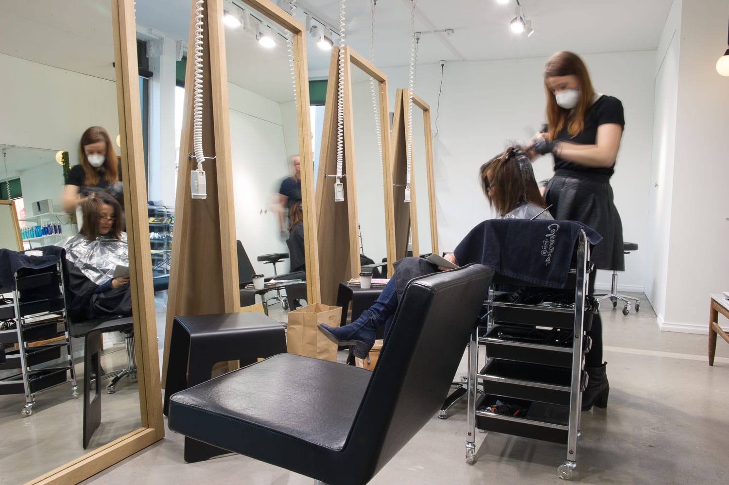 hairdresser doing client's hair