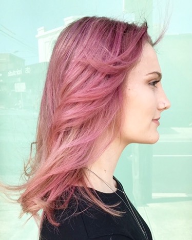 woman smiling with pink hairstyle - small image