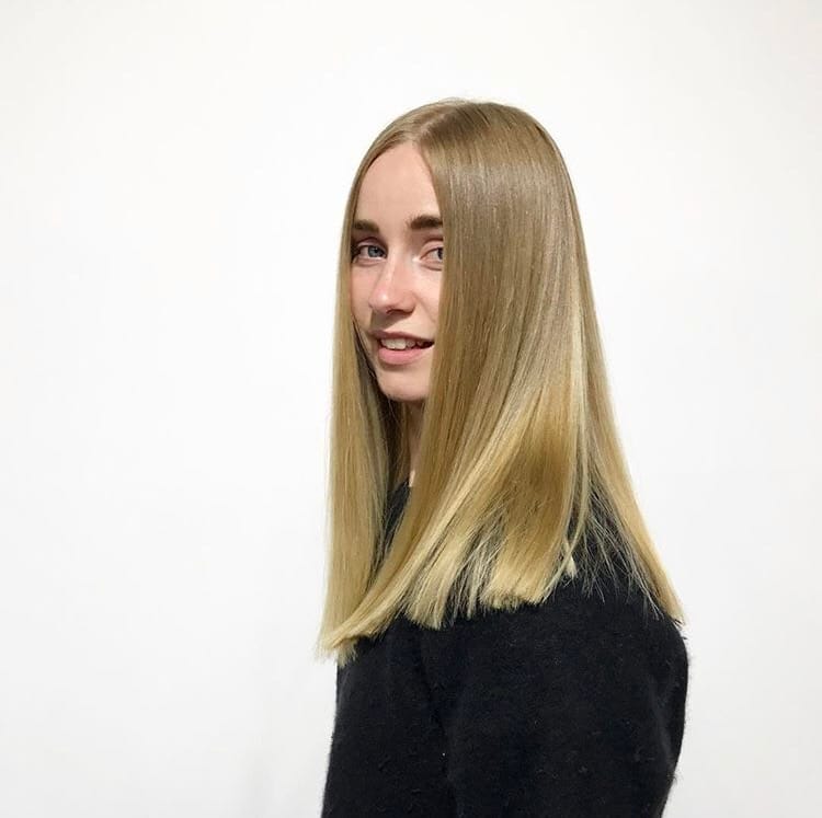 young woman with blonde hair smiling