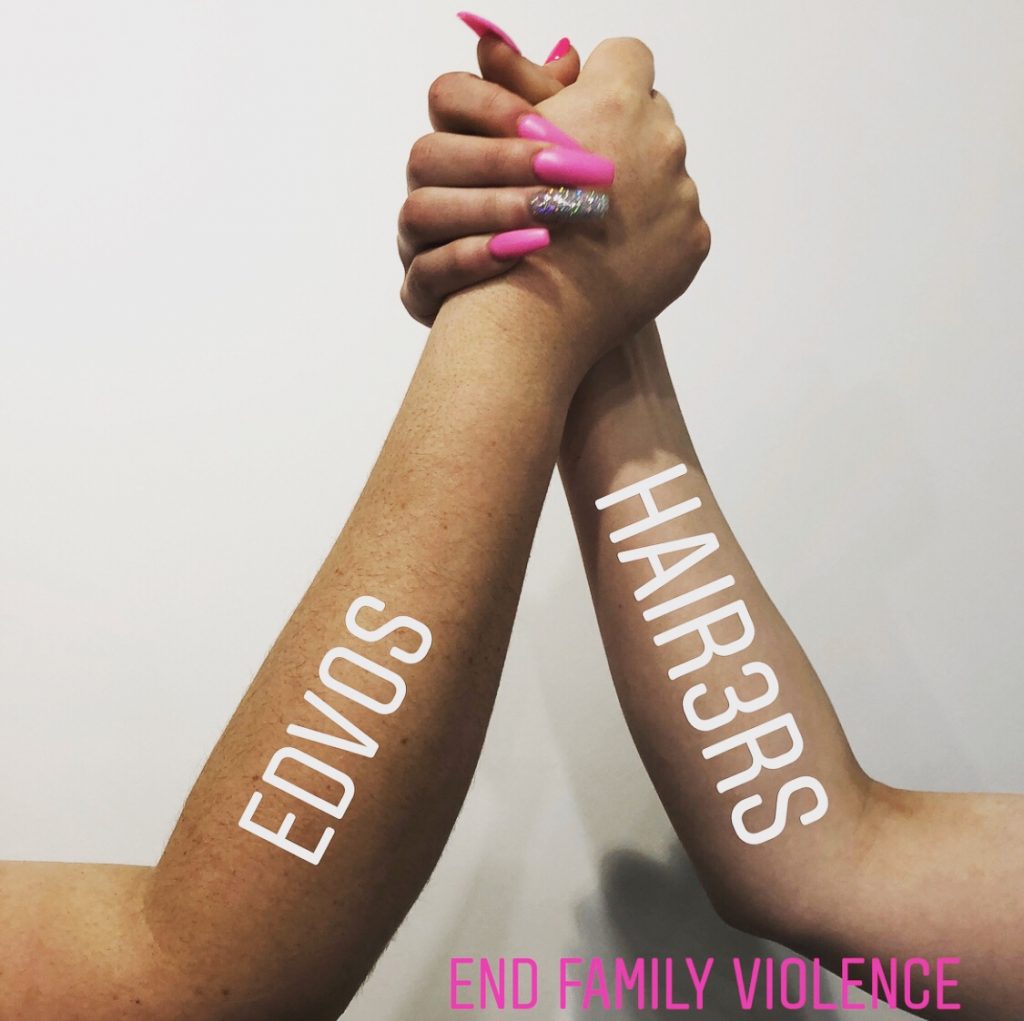 two hands together with captions on arms that says endcos, hair 3r's and end family violence