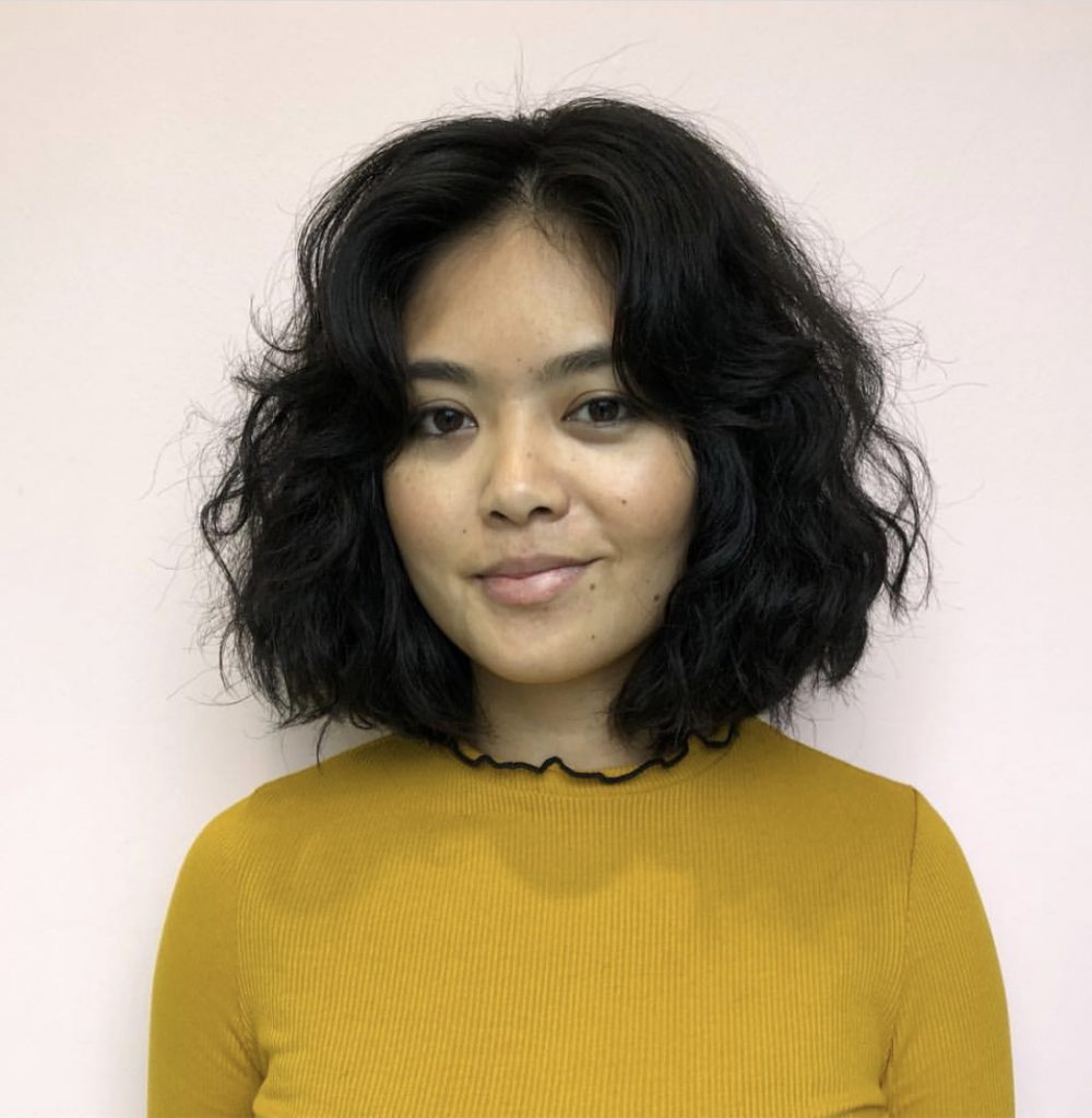 woman smiling with short hair