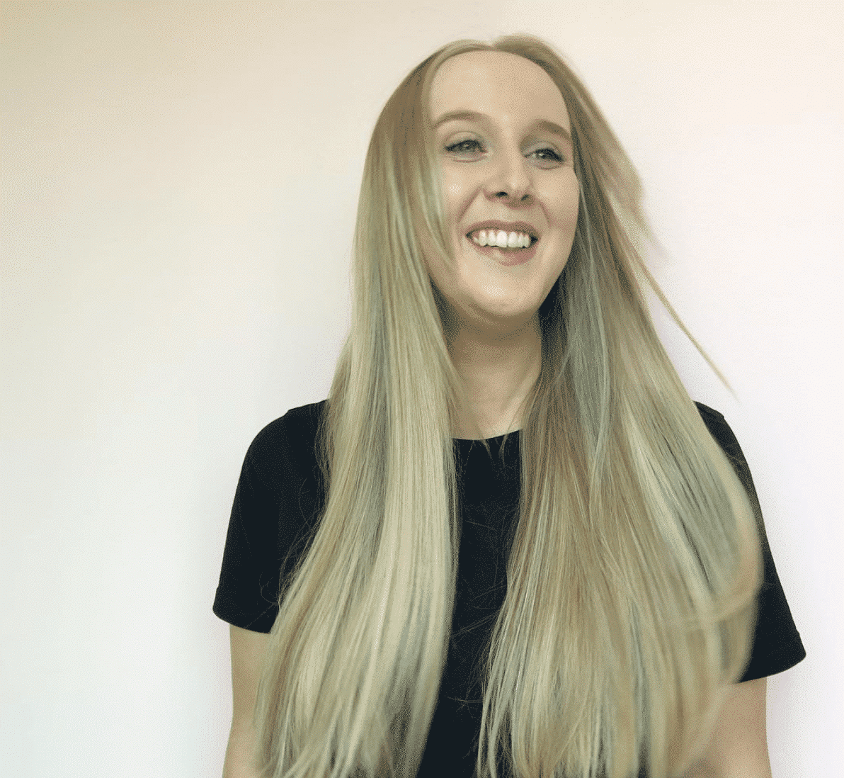 woman smiling with long blonde hair