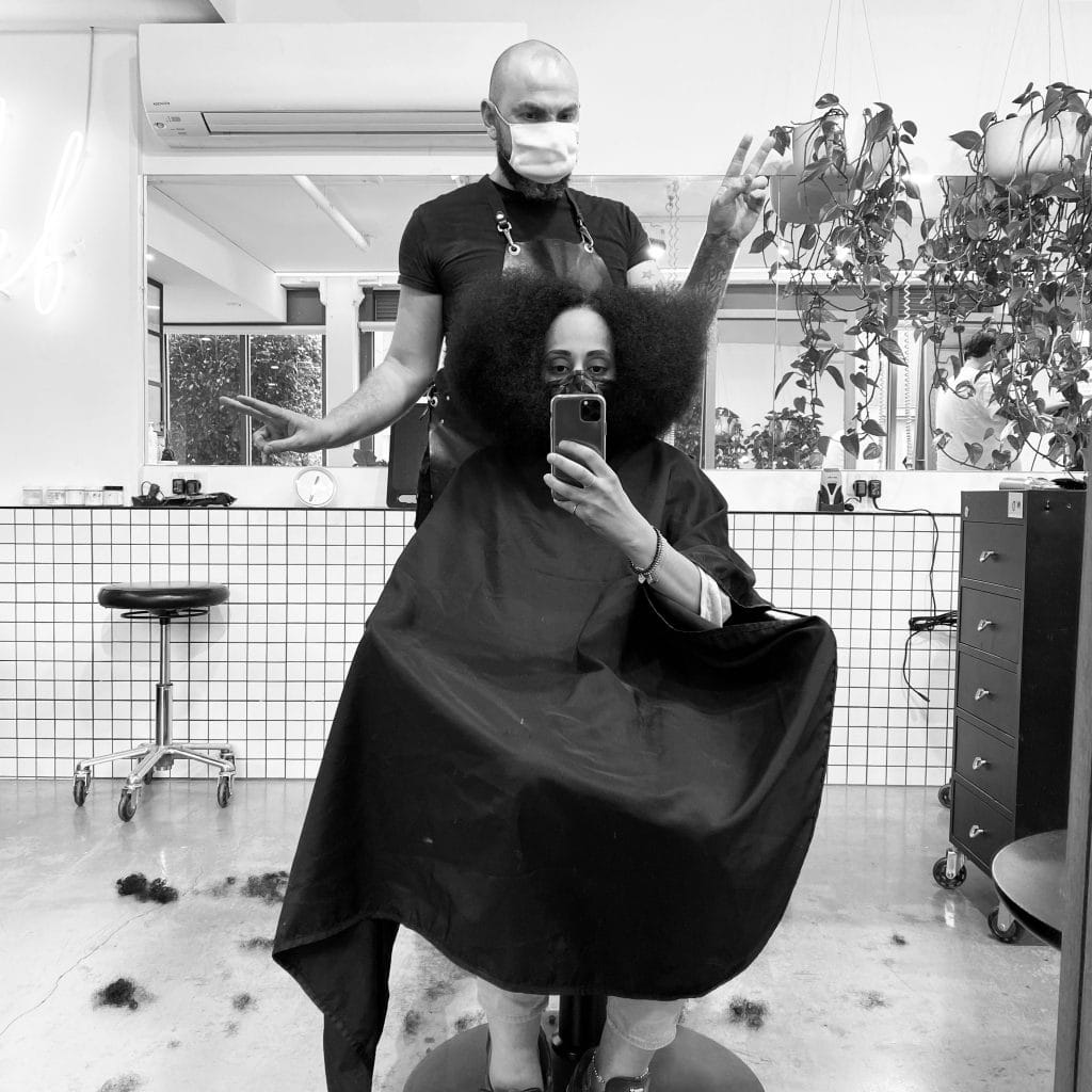 woman getting her haircut by hairdresser