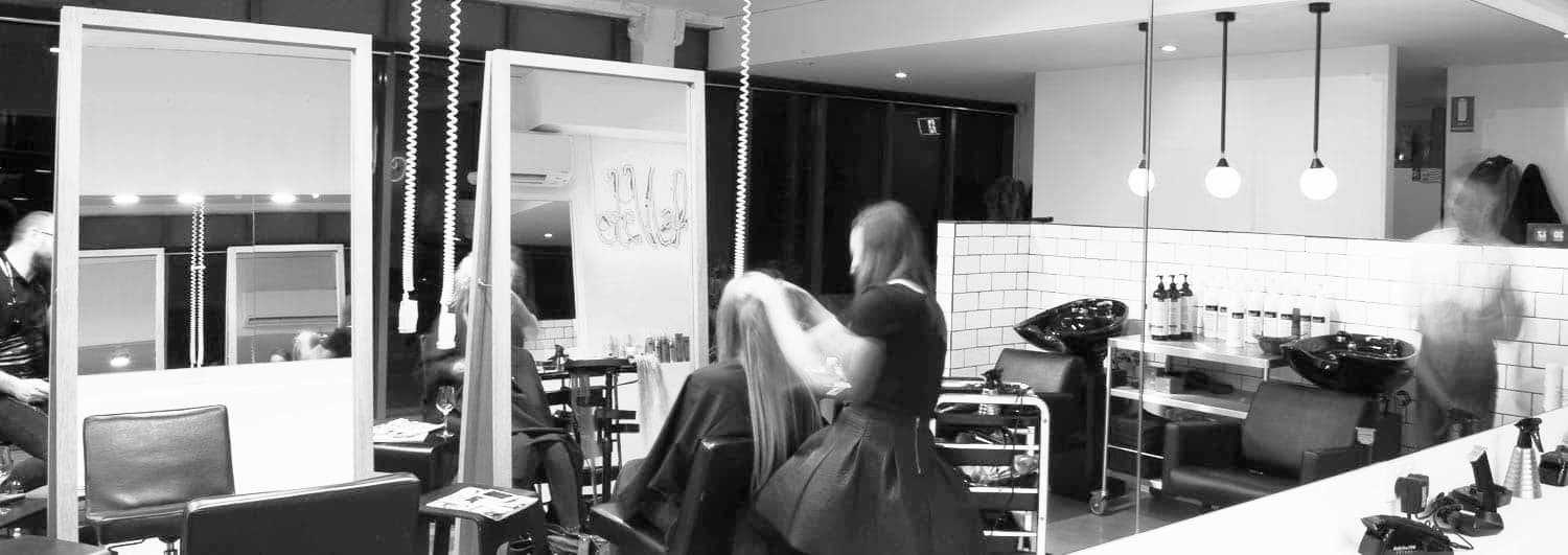 Chic black and white view of Delilah Hair Studio—experience expert styling in a vibrant, modern space. Book now.