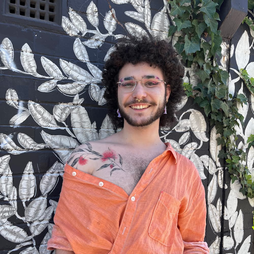 Lexi with short curly haircut and creative colour finish