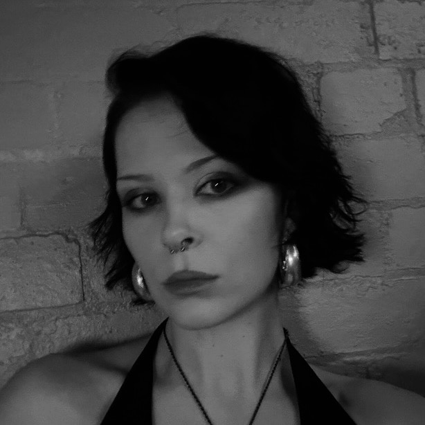 Paige with short dark wavy bob and soft side parting