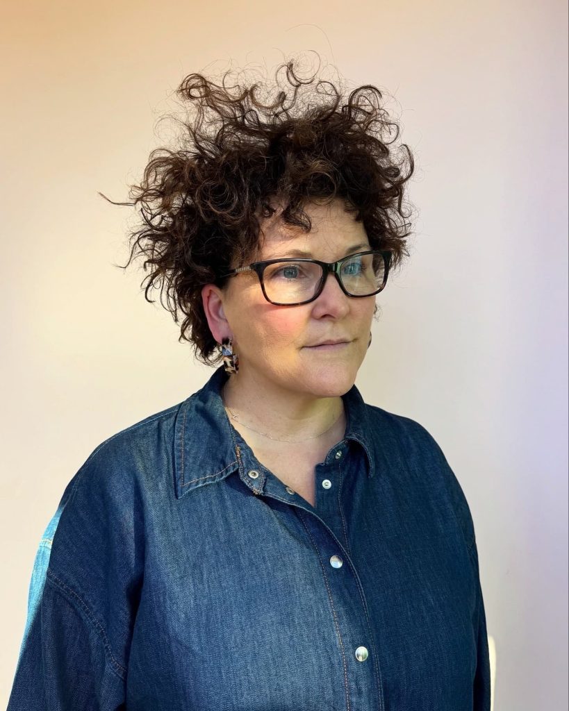 Curly pixie haircut on model