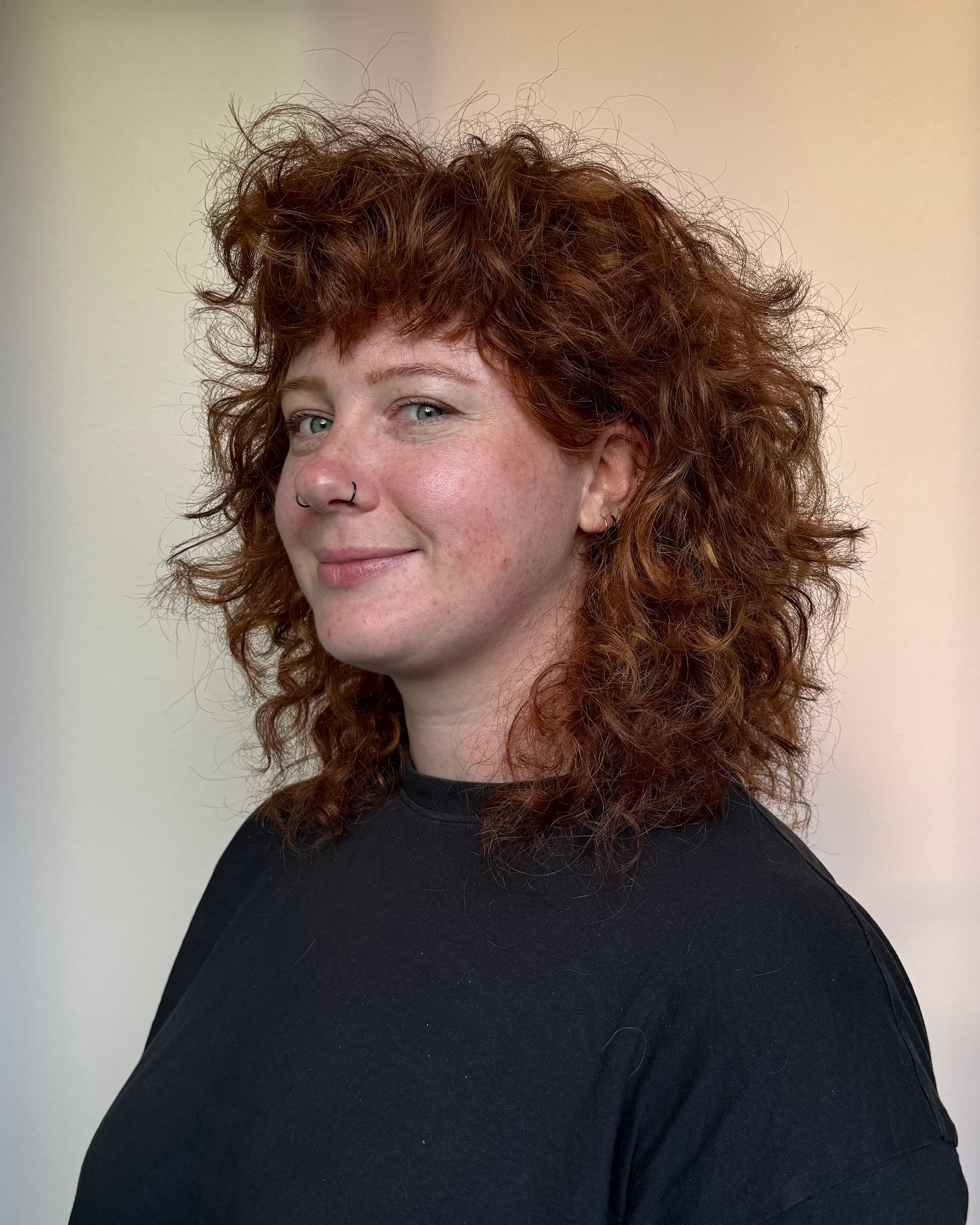 Curly shullet haircut by Delilah Hair Studio
