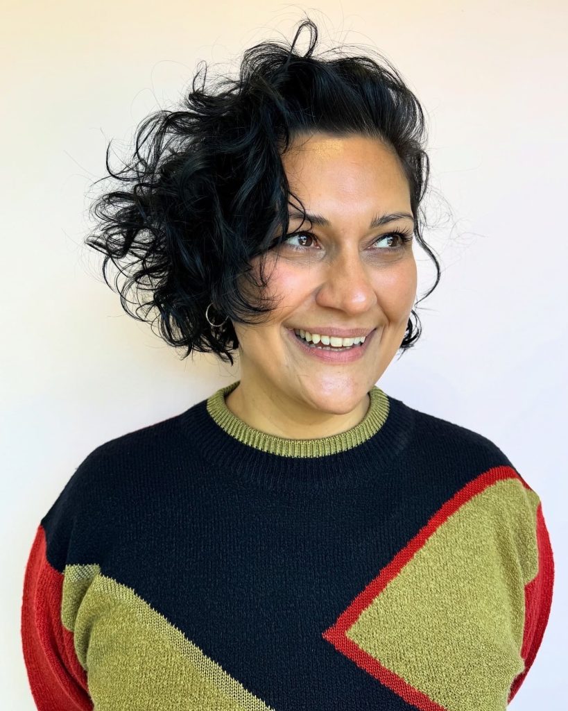 Short asymmetric curly bob by Delilah